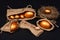 Eggs in golden color in burlap bags, nest and spoon