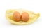 Eggs in luffa on white background