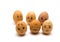 Eggs with painted emotions, psychology of society on a white background