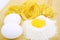 Eggs, pasta and flour on wooden desk