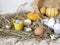 Eggs and quail eggs in a package, pumpkins , hay, Easter concept, preparation for the holiday, harvest, seasonal holidays