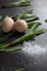 Eggs and Ramson on a black table, wood garlic and flour