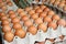 Eggs in stores are stacked together in large numbers.  Food shop business