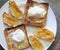 Eggs on toast and small croissants with marmelade jam