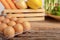 eggs on the wooden table and vegetable in a wood box