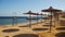 Egypt, Empty Sunny Beach with Umbrellas, Sun Beds on the Red Sea