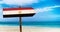 Egypt flag on wooden table sign on beach background. It is summer sign of Egypt