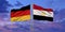 Egypt and Germany flag waving in the wind against white cloudy blue sky together. Diplomacy concept, international relations