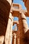 EGYPT, LUXOR - MARCH 01, 2019: ancient temple columns with hieroglyphs, drawings and inscriptions at Karnak in Luxor, Egypt