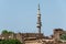 Egypt mosque with high minaret, located in the central city district in Luxor