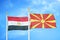 Egypt and North Macedonia two flags on flagpoles and blue cloudy sky