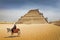 EGYPT\'S OLDEST PYRAMID, SAQQARA STEP PYRAMID, Egypt. Bedouin on a donkey