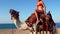 Egypt tourism with camel riding back for blond girl