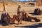 Egyptian boy near camels in bedouin village, Egypt