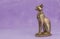 Egyptian cat Bast or Bastet, solar and war goddess, isolated on pink  background