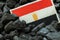Egyptian flag on charcoal background, Concept, Rising prices, Charcoal production costs, Environmental impact, Industry and the