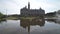 Egyptian geese on the Peace Palace pond, Vredespaleis, under the mist