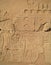 Egyptian hieroglyphs engraved on stone