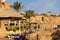 Egyptian hotel beach with deck chairs and thatched roofs