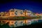 Egyptian houses at night reflecting in the lagoon