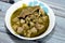 Egyptian kolkas plate cuisine, a delicious taro root stew made with a garlicky cilantro green sauce, taro, and homemade broth,