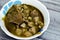 Egyptian kolkas plate cuisine, a delicious taro root stew made with a garlicky cilantro green sauce, taro, and homemade broth,