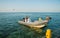 Egyptian man on inflatable motor boat showing greeting sign