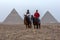 Egyptian men sit on their horses at Giza in Cairo, Egypt.