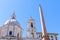 The Egyptian Obelisk in Piazza Navona, Rome, with the dome and b