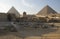 Egyptian Sphinx against the background of the ancient pyramids in Giza