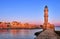 Egyptian or Venetian Lighthouse of Old Venetian harbour of Chania, Crete, Greece at sunrise. Soft sky colors from blue