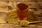 Egyptian yellow tea or Methi Dana drink and fenugreek seeds on wooden table