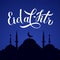 Eid al-Fitr calligraphy lettering and silhouette of mosque against night sky. Muslim holiday typography poster. Islamic