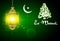 Eid Mubarak and quran with illuminated lamp