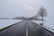 Eifel road, clear main road with snow falling again