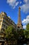 Eiffel Tower above Old Paris Neighborhood Building