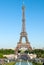 Eiffel Tower against a blue sky and Trocadero fountains