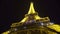 Eiffel Tower construction starts shimmering with many lights in night Paris