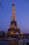 Eiffel Tower illuminated and the bridge Passerelle Debilly, view from the Seine quay in March 17, 2012 in Paris, France.