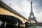 Eiffel tower and Jena bridge in a cloudy day