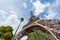 Eiffel tower and lamppost against blue sky in Paris