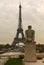 Eiffel Tower and The Man - L`Homme statue in Jardins de Trocadero during sunset in autumn, Paris, France