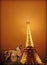 Eiffel tower at misty night in Paris, France