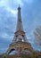 Eiffel tower on nasty sky with clouds, Europe travel,