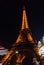 Eiffel Tower at night , foreground moving carousel