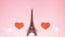 The Eiffel Tower, red and pink hearts on bright background. Stop motion animation with copy space. Romantic, love and Valentines