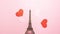 The Eiffel Tower, red and pink hearts on bright pink background. Stop motion animation with copy space. Romantic, love and