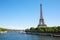 Eiffel tower and Seine river in a clear sunny day in Paris