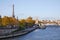 Eiffel tower, Seine river view and Alexander III bridge in an autumn day in Paris