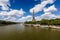 Eiffel Tower and Seine River with White Clouds in Background